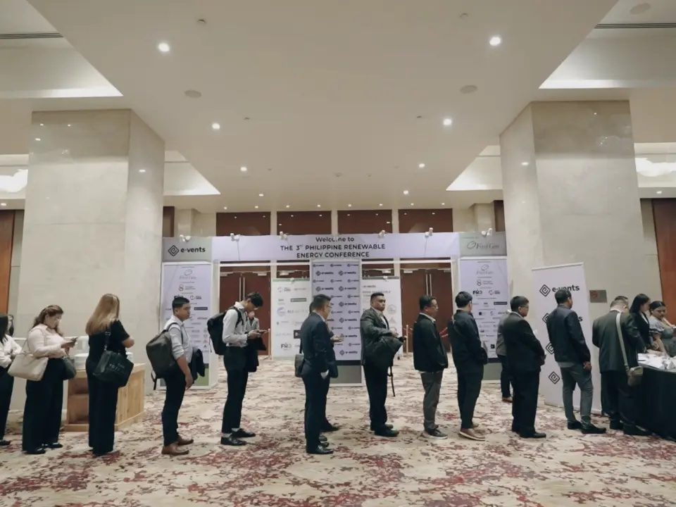 Delegates visiting exhibitor booths in the conference foyer