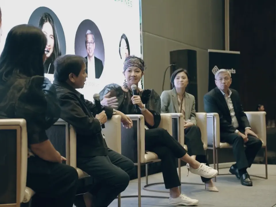 Renewable energy professionals speaking during a seated panel discussion