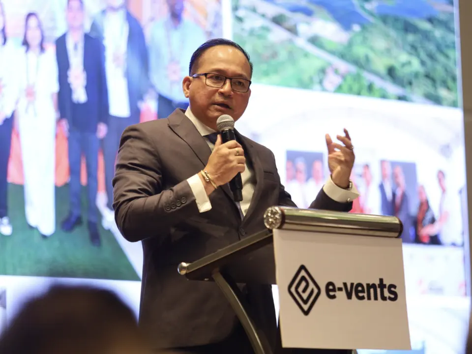 Energy industry speaker addressing delegates from the lectern
