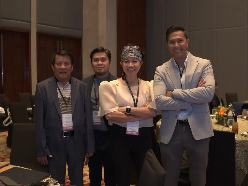 Four delegates posing together during the renewable energy conference